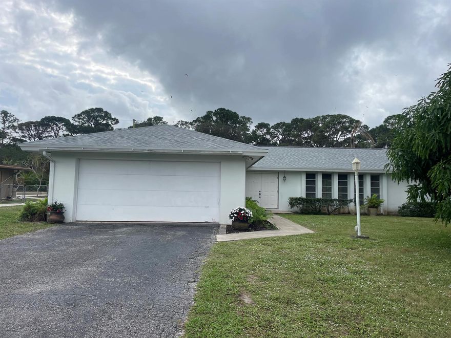 Incredible opportunity in a desirable West Palm Beach Neighborhood.  Big ticket item already taken care of, brand new roof in 2023!!!  Spacious four bedroom home, two bath, two car garage, large pool(need repair) on an oversize lot.  Preserve in the back yard for privacy.  This home has so much potential and truly a diamond in the rough.  Just needs a little tlc and perfect for a handyman.  Schedule a showing today as this will go fast!!