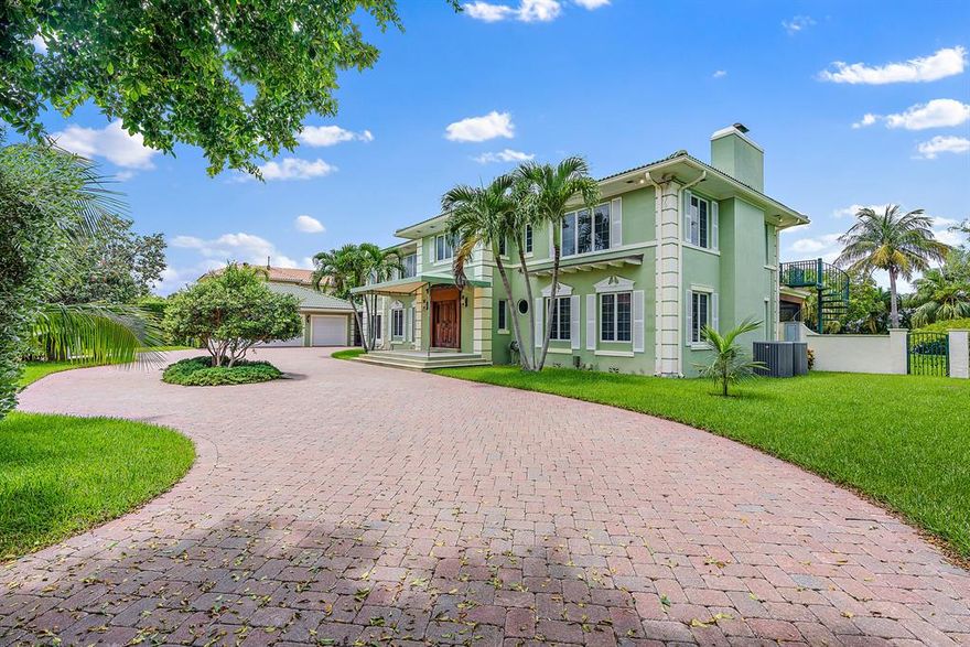 Secluded waterfront estate home on Singer Island with expansive intracoastal views and deep-water access.  This unique property on a 3/4-acre lot has a 140 ft protected dock with four boat slips just minutes away from the Palm Beach inlet.  Lush, mature landscaping surrounds a stone-decked 40 ft pool and generous open backyard perfect for entertaining. 
The 3 bedroom, 4½ bath gated home is completely hidden by stately hedges and features a separate 3 car climate controlled garage and circular drive with plenty of guest parking. A well-appointed 2 bedroom, 2 bath guest house feels like a tropical getaway with a private waterfront patio.
Minutes from 95 and PBIA, this boater's paradise could serve as your launching point for excursions to the Bahamas or other Atlantic Ocean destinations.