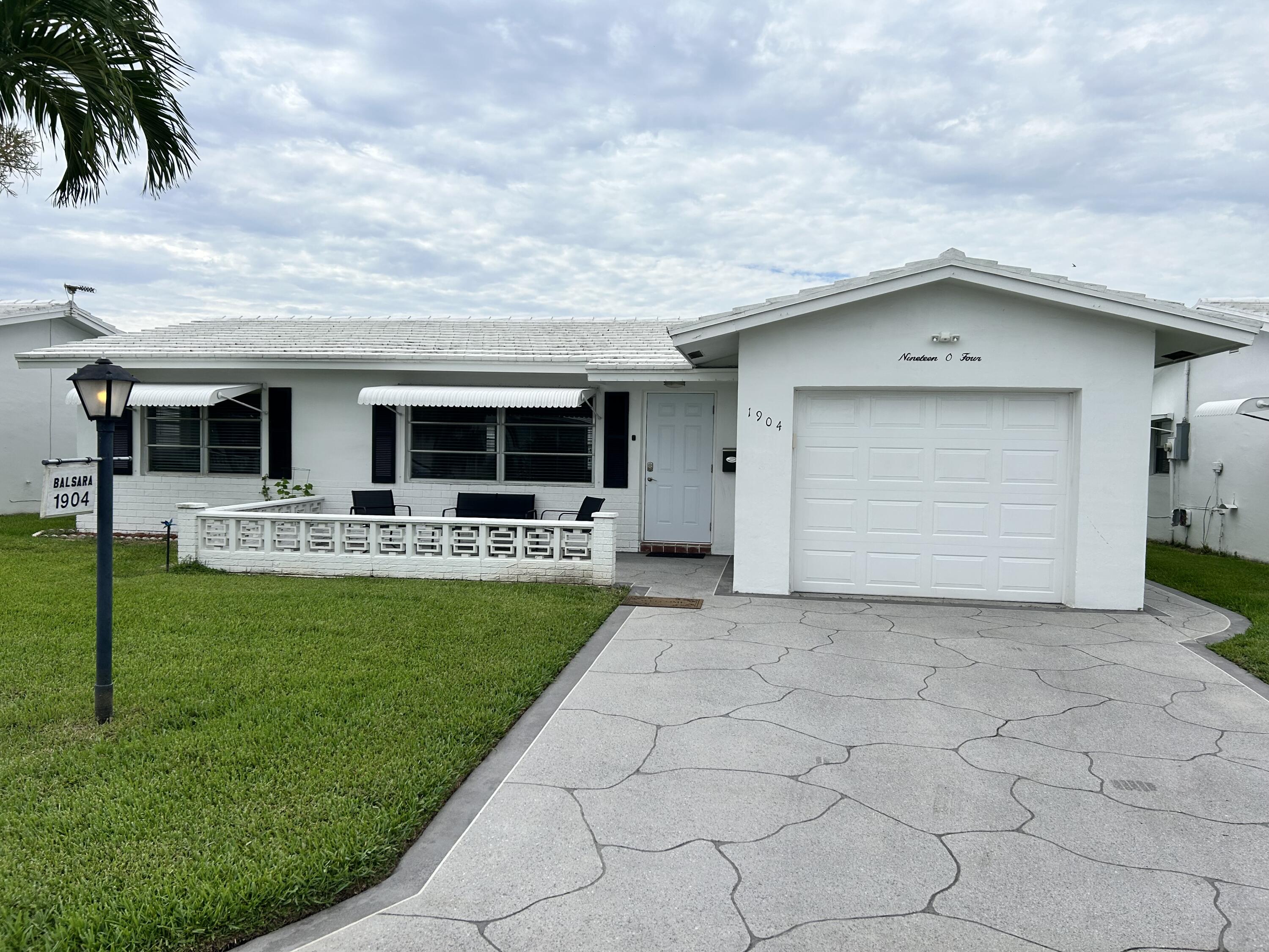 Nicely updated 2Br/2Ba Edgewood with full Florida room. FULLY FURNISHED. Tiled throughout. Kitchen cabinetry replaced with extra cabinets and granite counter tops. French door refrigerator. Master bath glass enclosed updated tile plus vanity, commode and electrical all replaced. Decorative front porch and double drive. Front and Back door replaced plus bifold screen doors. Garage door and pedestrian door replaced. Close to R3 Clubhouse and pool. Free 18 Par 3 golf. Minutes to Ocean beaches, shopping and restaurants