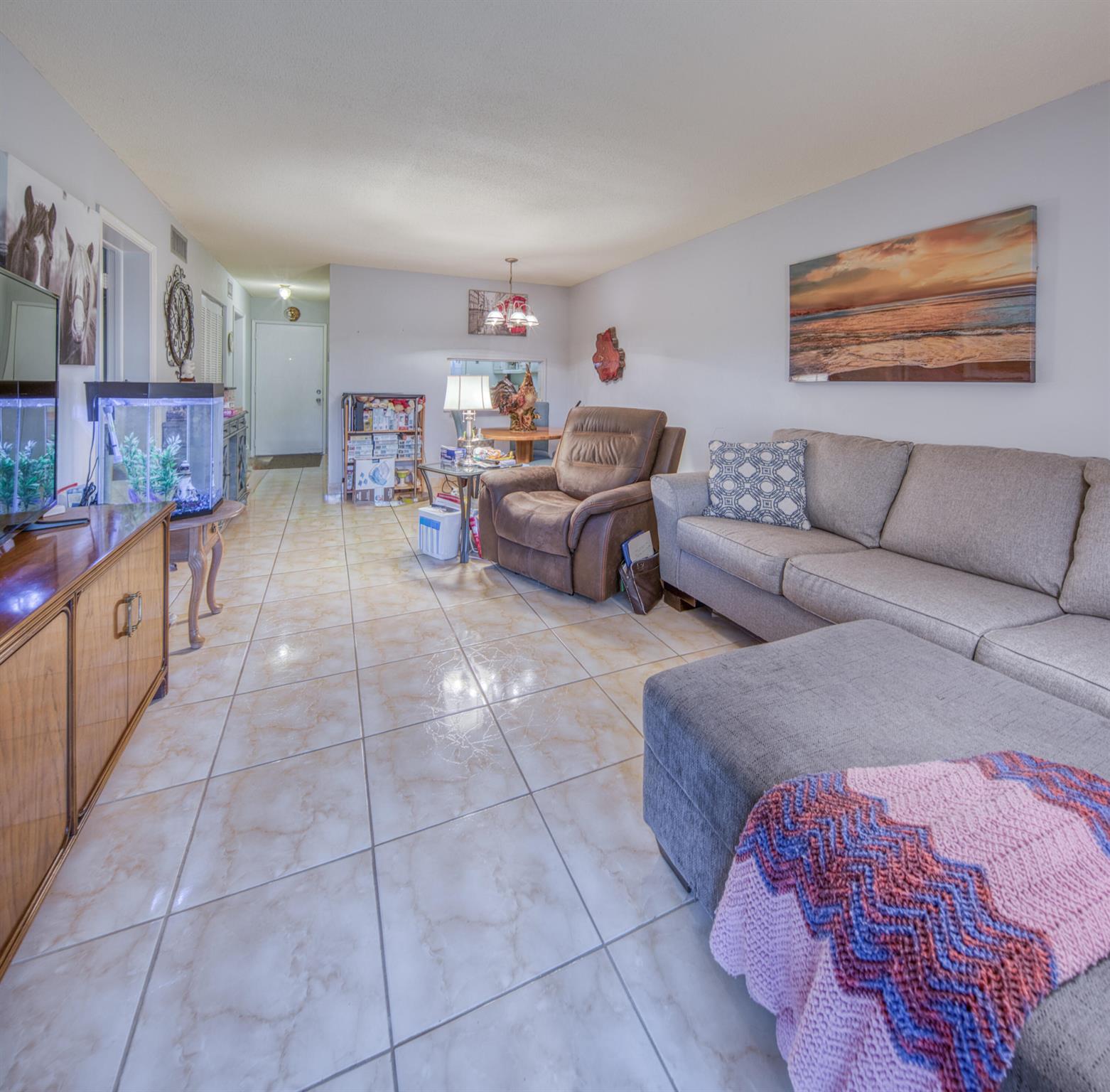 Nice and bright 1 bedroom ground floor apartment with 1 full bathroom and 1 half bathroom located in lively Lake Clarke Gardens 55+ community. Beautiful granite countertops in both bathrooms. Private screened in patio to enjoy the peaceful mornings and evenings.The community has two pools, sauna, a clubhouse, fitness center, library, putting green, and a courtesy bus. New AC 9/2019. Milestone inspection and SIRS done.