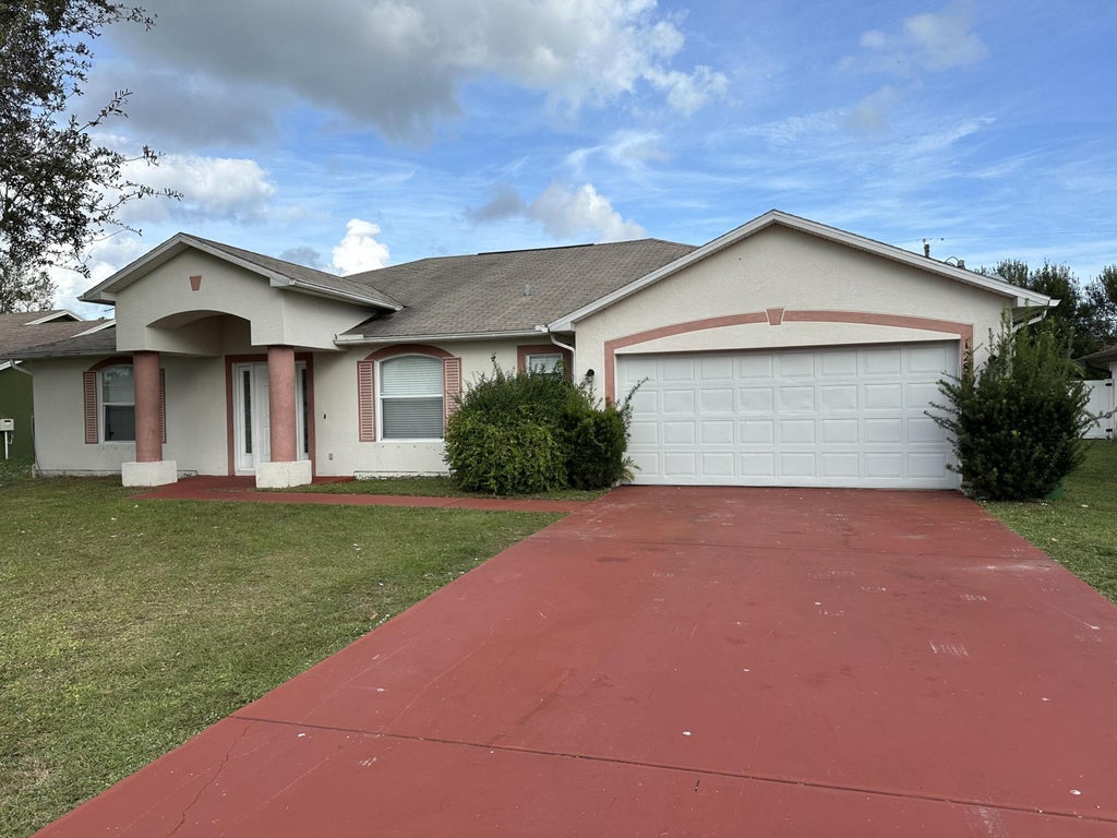 Photo of 1281 SE Sandia Drive, Port Saint Lucie, FL 34983 (MLS # R10940276)