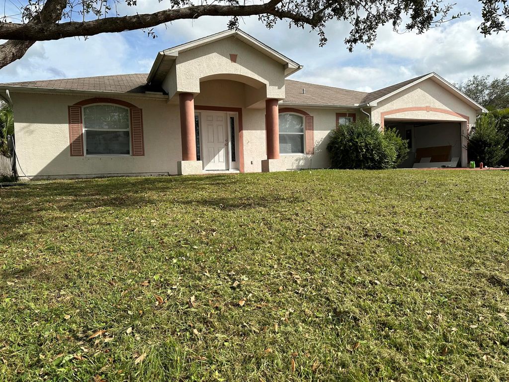 Photo of 1281 SE Sandia Drive, Port Saint Lucie, FL 34983 (MLS # R10940276)