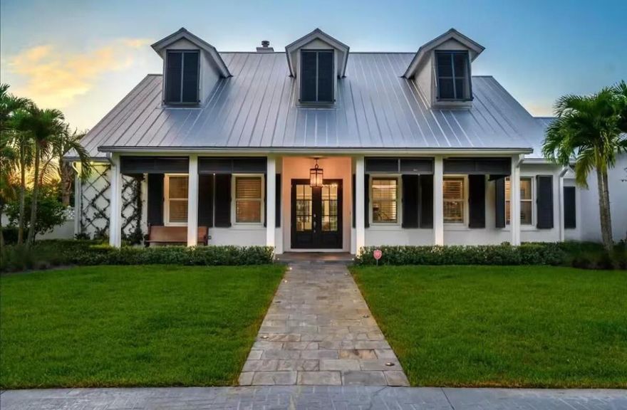 Experience elegance and luxury in this 5-bedroom family home in Wellington's prestigious Paddock Park II. Perfect for your seasonal getaway, the residence sits on 1.52 acres in a fully fenced property with lush palms, offering a resort-style heated pool, jacuzzi, and expansive outdoor areas. Inside, discover 4,000 sq. ft. of Southern charm with a gourmet eat-in kitchen featuring quartz counters, stainless steel appliances, and gas stove. The grand great room boasts a soaring 2-story ceiling, wood-burning fireplace, and custom built-ins. Additional highlights include a second sitting room, 3-car garage, hardwood floors, and two Level 2 Tesla charging stations. Golf cart distance to all equestrian venues, this exquisite property blends luxury, comfort, and equestrian convenience.