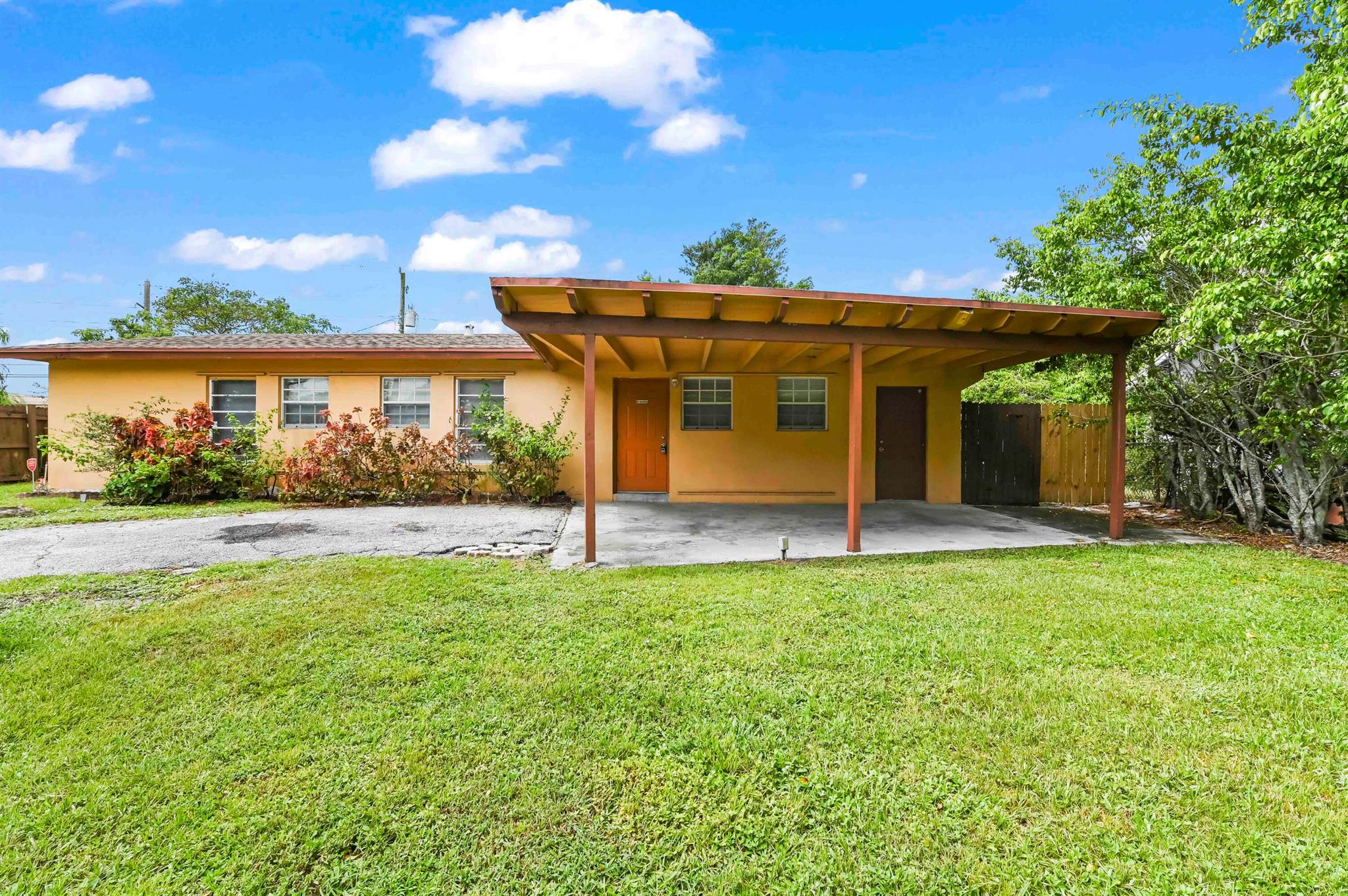 Discover this waterfront gem in West Palm Beach with no HOA and plenty of potential! This 3-bedroom, 2-bath home offers 1,248 sqft of living space and a serene canal-front setting. Enjoy an entry-level living room, a kitchen equipped with a refrigerator, electric range, and microwave, plus ample cabinets for storage. All bedrooms feature closets and the master bedroom has a private door leading directly to the patio. Additional highlights include a laundry area with a washer and dryer, a 1-car carport, a fenced backyard, and room to add a pool. Perfect for relaxing by the water or entertaining in your own private space!