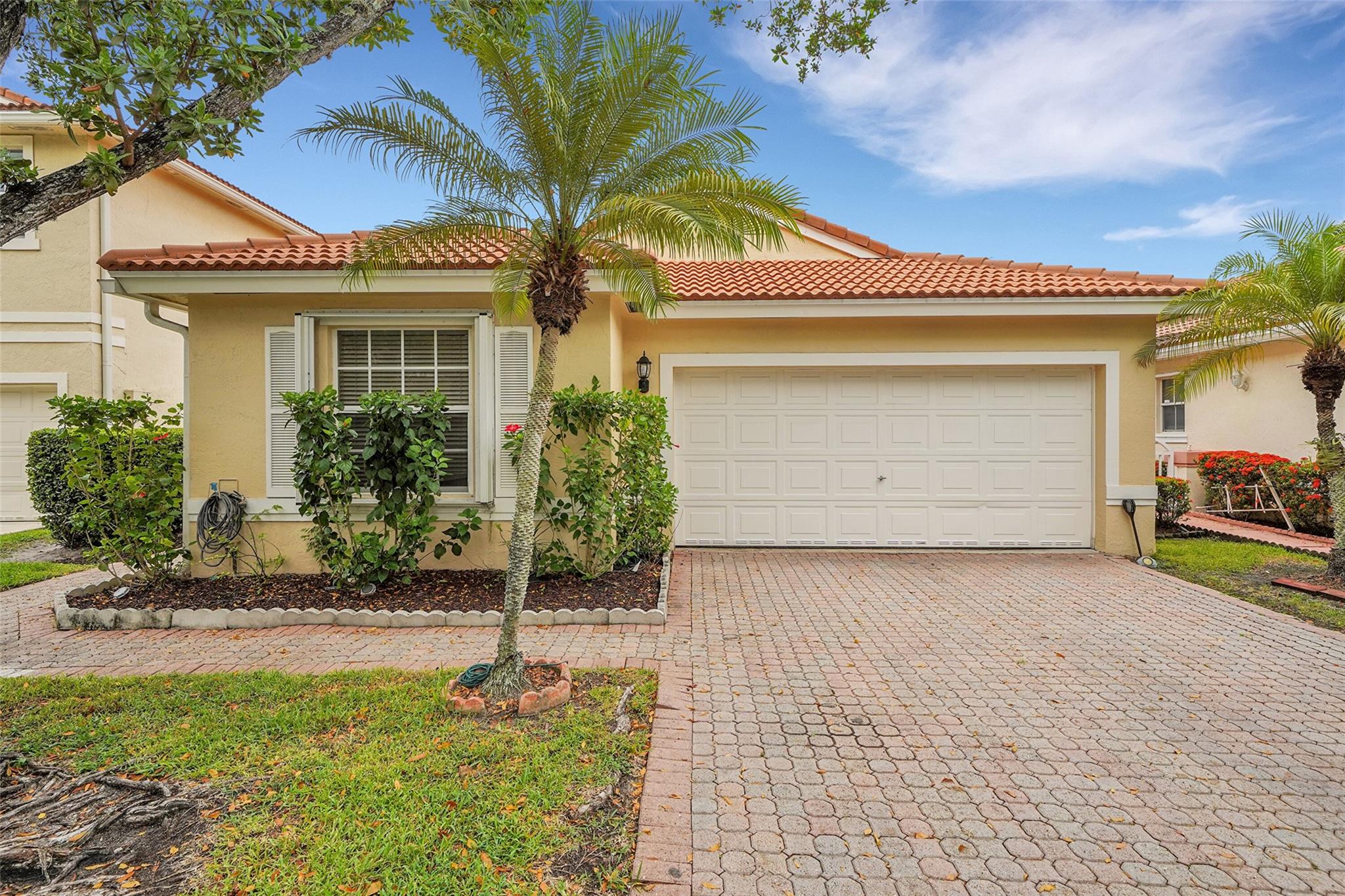 Completely Updated & Move-In Ready! Stunning 3-bedroom, 2-bathroom, 2-car garage home located in the gated community of Kensington Green. Enjoy your private gated front entrance with accordion shutters throughout. Step inside to an open-concept layout featuring sleek 36x36 porcelain tile flooring, soaring ceilings, and a spacious living area that seamlessly connects to a beautifully renovated kitchen with Samsung appliances, soft-close cabinetry, and ample storage. Both bathrooms have been tastefully updated with dual sinks and modern finishes. Zoned for top-rated schools and just minutes from shopping, dining, parks, and major highways. Low HOA in a quiet, well-maintained, family-friendly community. This home checks all the boxes—don’t miss your chance!