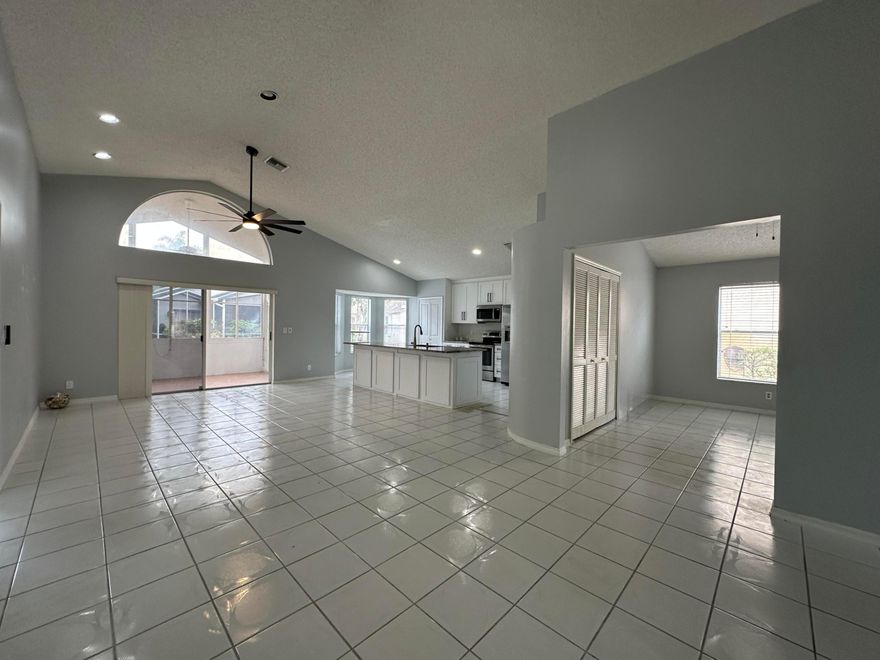 Single Family Home in River Bridge; a Guard Gated Community with all the Amenities you could hope for and a LOW HOA Fee: Clubhouse, Pool, Spa, Tennis, Basketball, Playground, and Sidewalks lined with Mature Oak Trees. This 3/2 home(used as a 2/2 plus Den) has an amazing Kitchen Remodel, including White Wood Soft Close Cabinets, 42'' Uppers, Stainless Steel Appliances and Granite Tops with Large Island, completed in late 2023, along with Interior Paint, New Ceiling Fans and New Door Hardware throughout. The home has Vaulted Ceilings, Tile Throughout, Recessed Lighting, an Enclosed Sun Room and a 2 Car Garage. Pets Welcome.