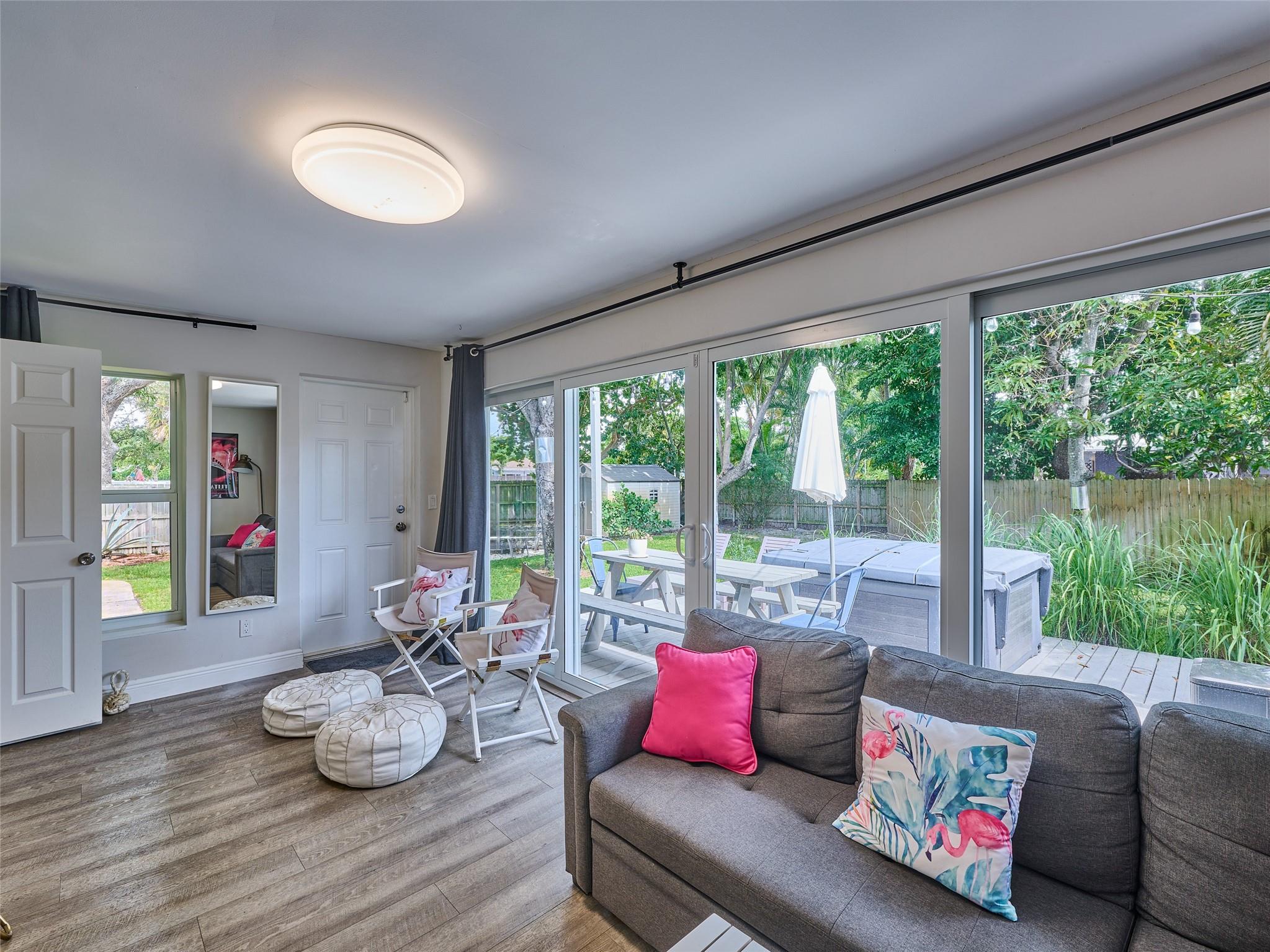 Enjoy the ultimate Florida lifestyle in this beautifully remodeled and fully furnished 3-bedroom, 2-bathroom home—perfectly located just 10 minutes from the beach and 5 minutes from vibrant Downtown Fort Lauderdale and Las Olas! Situated on an oversized 1/3-acre corner lot, this private retreat offers a spacious backyard oasis featuring a hot tub, patio deck, fire pit, BBQ station, outdoor shower, and plenty of room to relax or entertain. Inside, you'll find modern updates throughout, including impact windows, newer roof, plumbing, and electrical systems for peace of mind. Whether you're here for a short stay or an extended getaway, this stylish and comfortable home has everything you need.