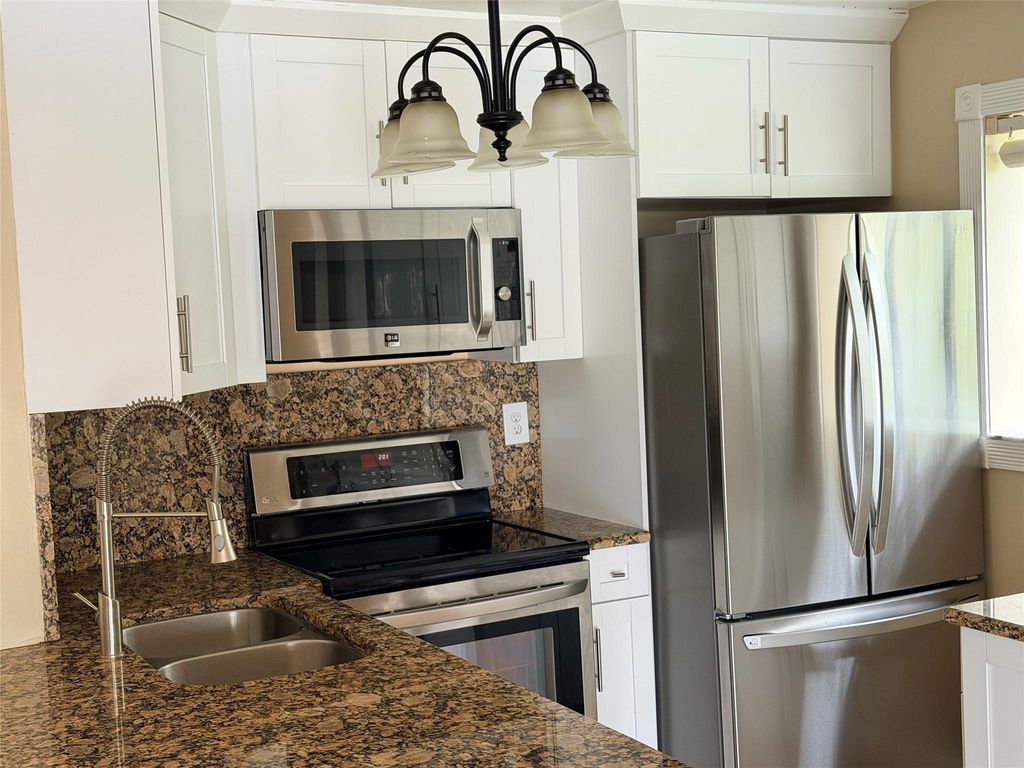 Photo of 2749 S Oakland Forest Drive #203, Oakland Park, FL 33309 (MLS # F10549615)