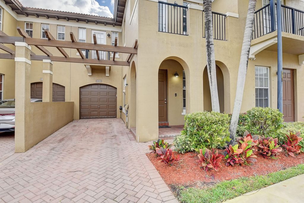 Photo of 6854 Julia Gardens Drive, Coconut Creek, FL 33073 (MLS # R11021298)