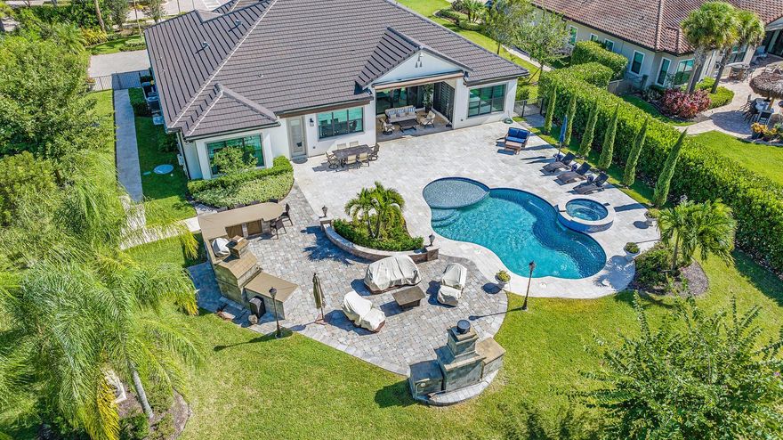 Come stay in paradise!! The tranquil backyard is its own oasis! You will feel like you have your own resort living. This very spacious home offers 4 bedrooms, 5.5 baths, a Club Room, private Office. An open floor plan with gorgeous views of backyard and pool. Step down pool with spa. Outdoor has (3) awnings which extend remotely for additional shade. Club room has large TV, wine bar, and Treadmill. Split floor plan. Designer finishes and comfort through-out. 3-car garage. Cabana bath.  Gated community, ADT system, impact windows. Come and enjoy true Paradise!!!  Close to shops, restaurants, entertainment, beaches. Near I95 and Turnpike. (Season -Security $15k,13% Tax,, HOA Interview required. Elec includes up to $400/mth.)Annual rental available at $19k/mth includes Lawn, Pool, Water