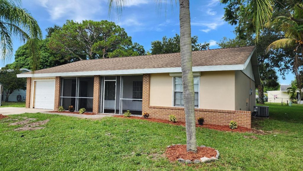 Photo of 342 NE Surrey Street, Port Saint Lucie, FL 34983 (MLS # R11107020)