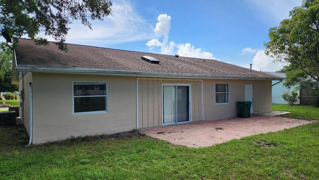 Photo of 342 NE Surrey Street, Port Saint Lucie, FL 34983 (MLS # R11107020)