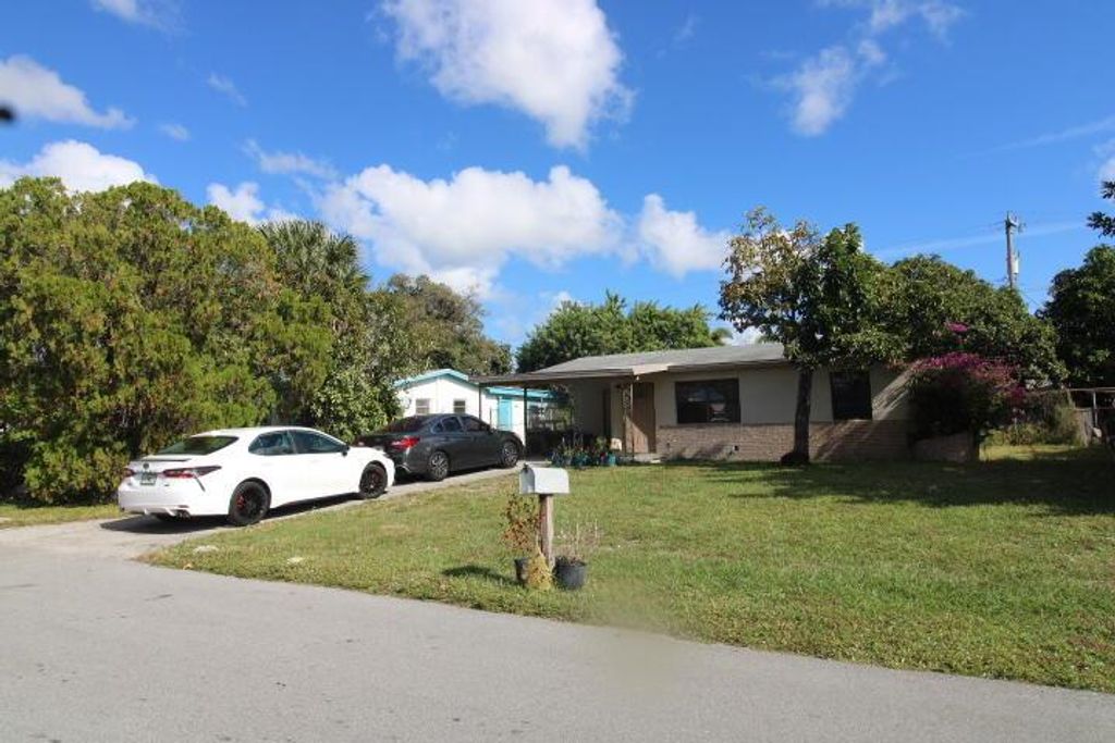 Photo of 5702 Briarwood Street, Mangonia Park, FL 33407 (MLS # R11147562)