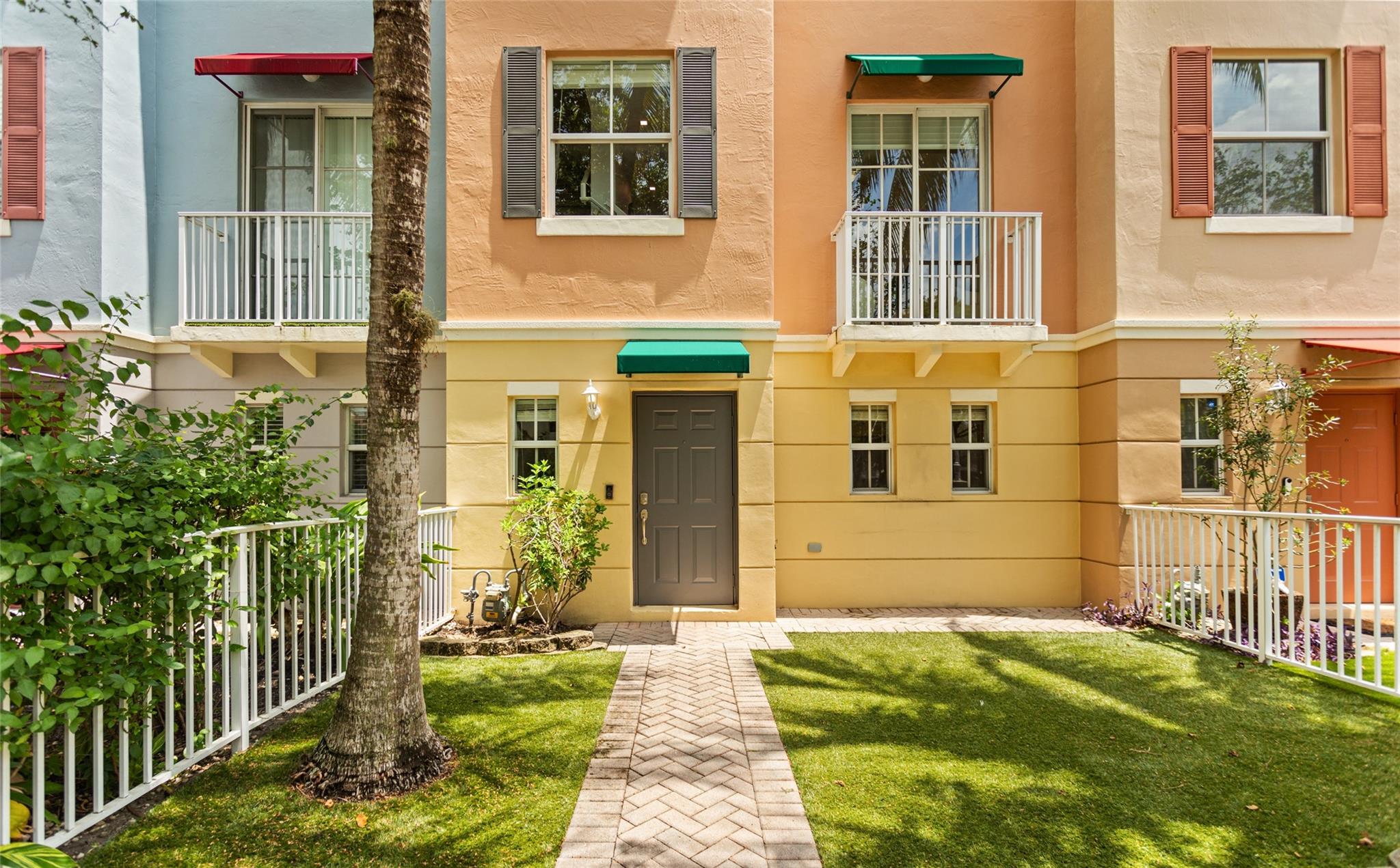 THIS IS CURRENTLY THE LEAST EXPENSIVE TOWNHOME IN VICTORIA PARK! Impeccably maintained 3-level townhome offering 3 bedrooms, 3.5 bathrooms, and an attached 2-car garage. Features include a 2018 A/C, gas tankless water heater, FULL IMPACT WINDOWS AND DOORS and new laminate flooring throughout. The modern kitchen boasts quartz countertops with waterfall design, a gas stovetop, updated cabinetry, and a custom buffet serving area—ideal for entertaining. Additional highlights include a new washer and gas dryer, custom closet organizers and a private front courtyard with low-maintenance turf grass. The community pool is a quick 30 second walk. Quarterly HOA fees include roof repairs, exterior insurance, exterior painting and landscape maintenance. Conveniently located near EVERYTHING!