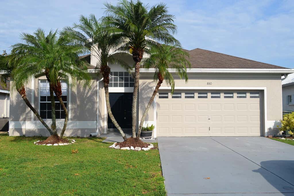 Photo of 880 NW WATERLILY Place, Jensen Beach, FL 34957 (MLS # B26062730)