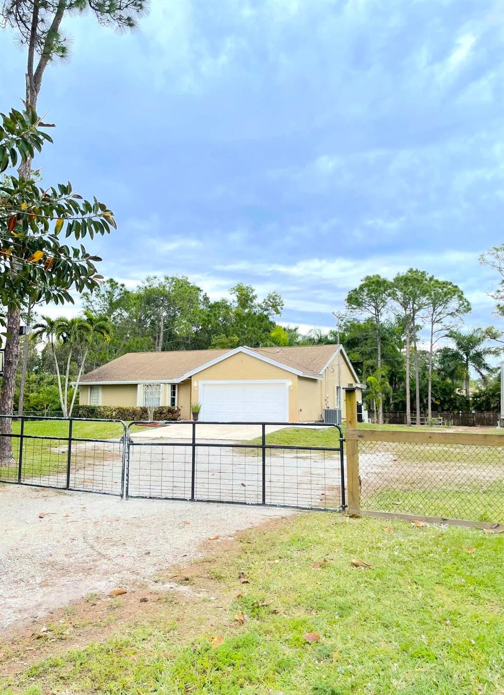 Photo of 15827 Key Lime Boulevard, Loxahatchee, FL 33470 (MLS # R10948699)