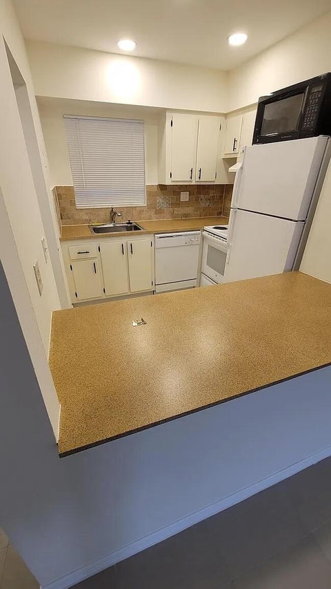 Photo of 6501 Winfield Boulevard #A-40, Margate, FL 33063 (MLS # B26022632)