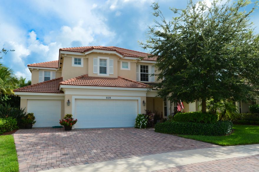 Magnificent two story home in gated community. Beautiful tile floors on the first level. Spacious living areas with open  family room, kitchen and breakfast nook. Center island in the kitchen for large gatherings. Very private back yard with room for a pool. The second floor offers an open loft area, huge master suite with a bonus sitting room. Master bath features a large soaking tub, separate walk in shower, his and her vanity. Close to shopping and beaches. Hurricane impact windows.