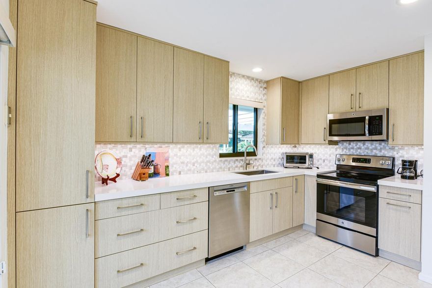 Gorgeous renovated, fully furnished turnkey villa available for off-season rental in the highly desirable Jonathan's Landing community of Windward Village in Jupiter. This light and bright 2BR/2BA villa features updated walk-in showers, brand-new appliances, tile flooring throughout, spacious living and dining areas, eat-in kitchen, split bedrooms for privacy, and an enclosed Florida room overlooking manicured gardens and the community pool. The primary suite offers a sitting area, dual sinks, updated shower, and ample closet space. Includes in-unit washer/dryer and 2 parking spaces with 1 covered. Minutes to beaches, golf, shopping, dining, Harbourside, and PBI Airport.