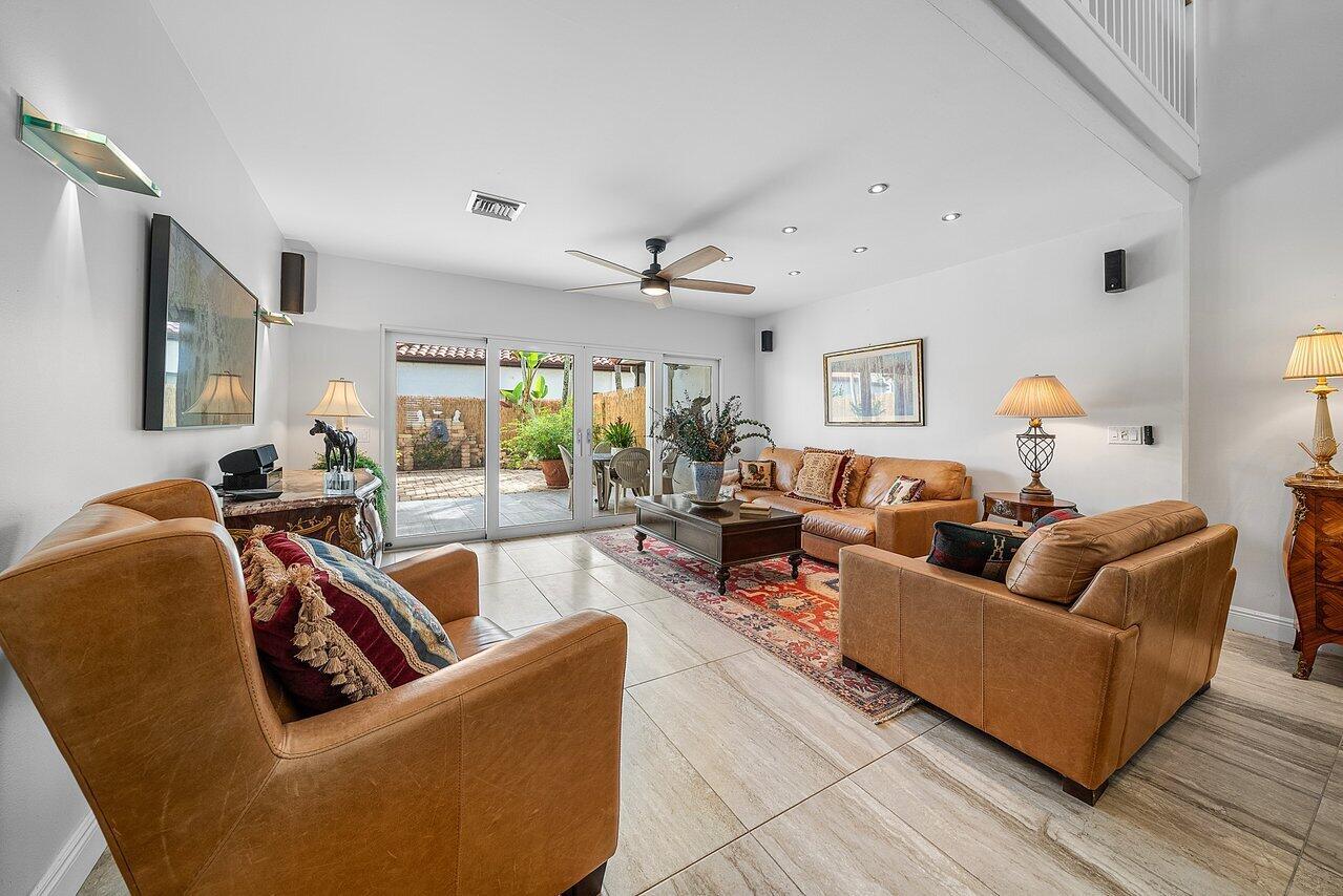 Welcome to your dream retreat in the heart of Wellington! Just a short golf cart ride to the world-renowned equestrian showgrounds, this fully renovated 4-bedroom, 2.5-bath townhouse offers the perfect blend of luxury and location.Step inside and be transported to a European villa, where high-end finishes and thoughtful design meet effortless style. The spacious downstairs primary suite features a spa-like bathroom that exceeds expectations, while the beautifully appointed kitchen boasts sleek Bosch appliances, ideal for both everyday living and entertaining.Tastefully decorated with European linen sheets and designer touches throughout, this home offers a warm, inviting atmosphere. Enjoy the Florida sunshine on your private brick patio surrounded by lush, manicured landscaping--or