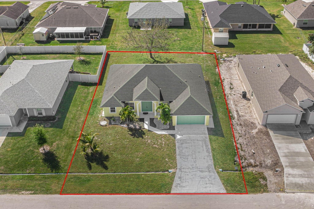 Photo of 1450 SW Santiago Avenue, Port Saint Lucie, FL 34953 (MLS # R10960961)