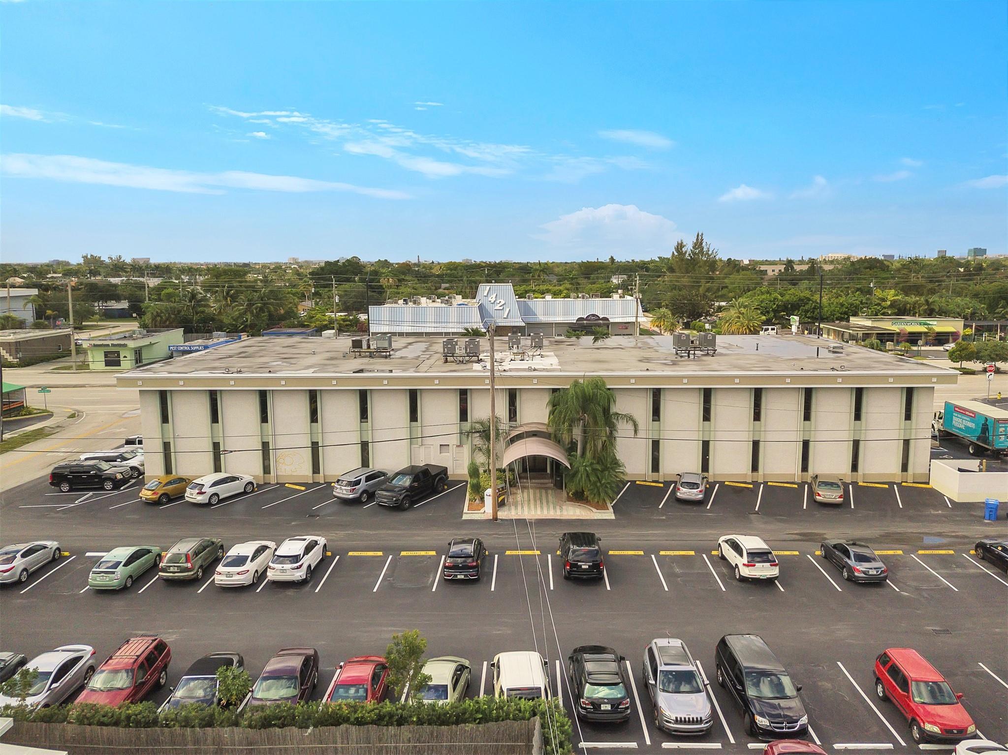 Two-story building located in the vibrant community of Oakland Park, Florida. This traditional office building features a Mid-Century Modern design with prominent vertical windows that provide natural light, creating an inviting atmosphere for clients and employees. The recently updated ground-floor unit, situated at the NE corner of the building, includes 7 private offices, a conference room, a restroom, and a kitchen area. The building offers common area restrooms and ample parking, including 2 assigned spaces and plenty of free parking. move-in ready, following amenities included in the common area maintenance (CAM): fire alarm, elevator access, building insurance, maintenance and repairs, water and electric service, landscaping, pest control, and upkeep of common hallways and restrooms