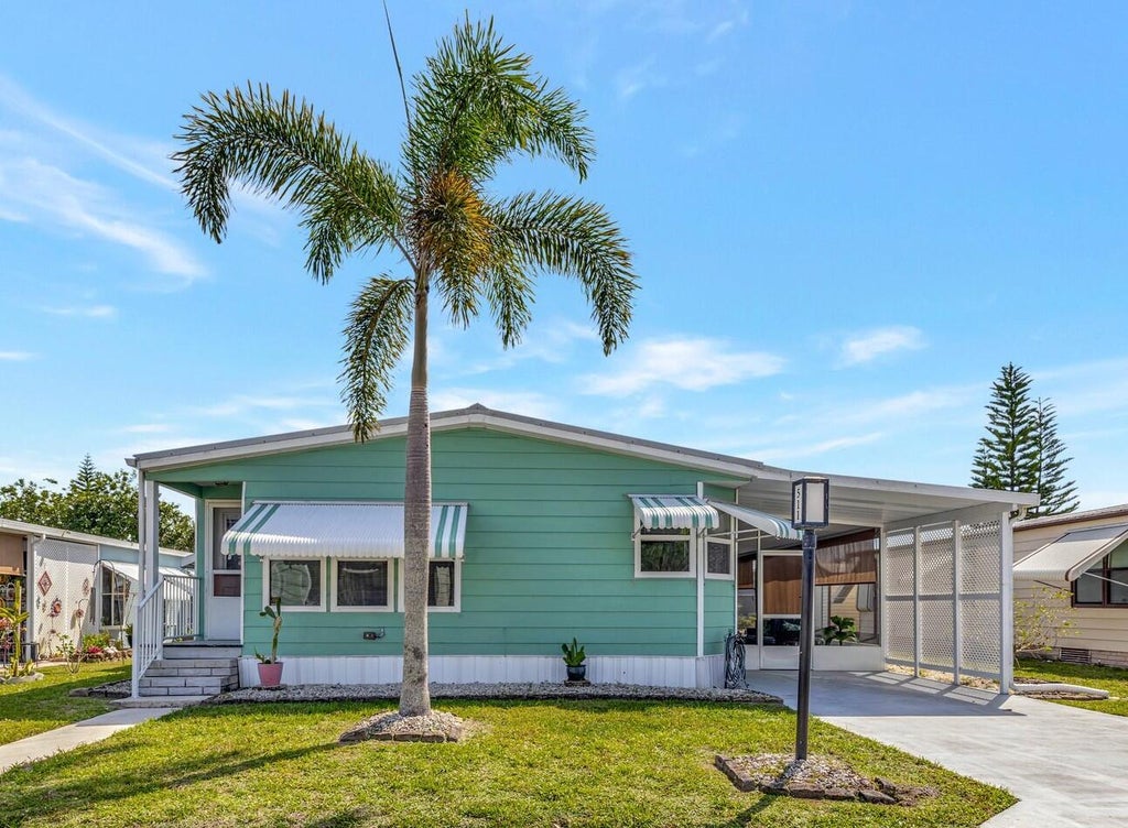 Photo of 511 Ann Marie Lane, Port Saint Lucie, FL 34952 (MLS # R11065164)