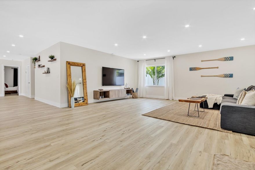 Welcome to your beautifully renovated 4-bedroom, 2-bath home in East Hollywood! Upon entering, you’re greeted by an oversized living room, ideal for entertaining. The flat ceilings and brand-new flooring create an elegant and modern ambiance throughout. The den offers flexibility as an office or game room. The updated kitchen features stainless steel appliances, an eat-in bar, & a separate dining area. The 2 bathrooms have been stylishly renovated w/ a sleek black-and-white design, offering clean, modern lines. Step outside to a spacious backyard, perfect for outdoor gatherings. While large enough for a pool, the yard is already designed for relaxation with a seating area, a fire pit, & an awning for shade. Plenty of parking is available for friends & family.