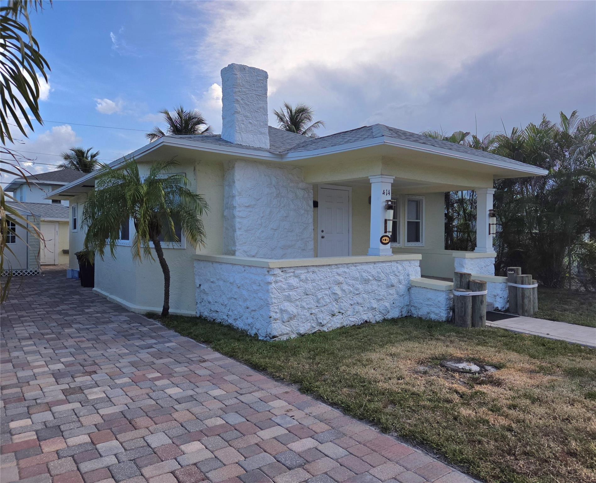 This beautifully renovated 1921 historic home, offers the perfect blend of vintage charm and modern convenience. Newly renovated kitchen and both bathrooms with 34x34 porcelain wall tile. 12x24 Italian porcelain flooring in kitchen and both bathrooms. New roof. Paver driveway that could handle a motor home. Central ac, hurricane shutters, window treatments. Detached 10x10 storage room, rated to 160 mph. Studio includes a fully equipped kitchen, ac, Corian countertop, 30" stove, washer/dryer. Located within walking distance to Publix, Joseph's Market, Bedner's Grocery Market, Starbucks, a variety of restaurants. Close to CityPlace, Brightline and Tri-Rail stations, and Flagler Drive- ideal for walking, running or biking. This home offers access to the best elementary school in the region.