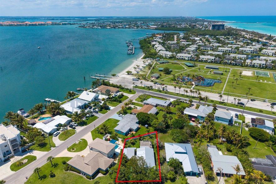 Private beach access just steps from your front door. Located in the Surfside enclave on South Hutchinson Island, this coastal home blends Old Florida character with modern comfort & true island lifestyle. Golf cart & boater friendly, positioned between the ocean & Intracoastal with quick access to beaches, parks, dining, & the inlet. Set on a deep, fully fenced lot with upgraded landscaping & mature palms, offering rare privacy. From the front yard, you can hear the ocean. Backyard features a custom tiki hut, fire pit, & outdoor shower. Upgrades include a 2022 metal roof, impact windows, Florida-style shutters, quartz countertops, renovated bathrooms, updated lighting, tankless water heater, enclosed garage door carport, covered storage, & a secure lock and leave with income potential.