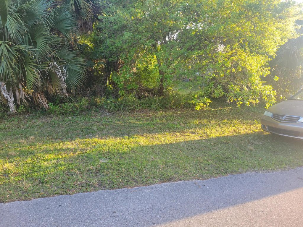 Photo of 1320 SW Granville Avenue, Port Saint Lucie, FL 34953 (MLS # R11049505)