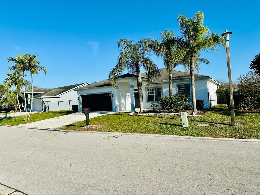 Photo of 1196 Hatteras Circle, Greenacres, FL 33413 (MLS # R11057961)