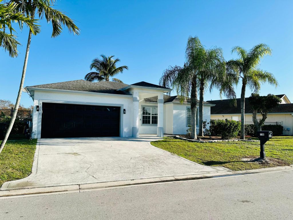 Photo of 1196 Hatteras Circle, Greenacres, FL 33413 (MLS # R11057961)