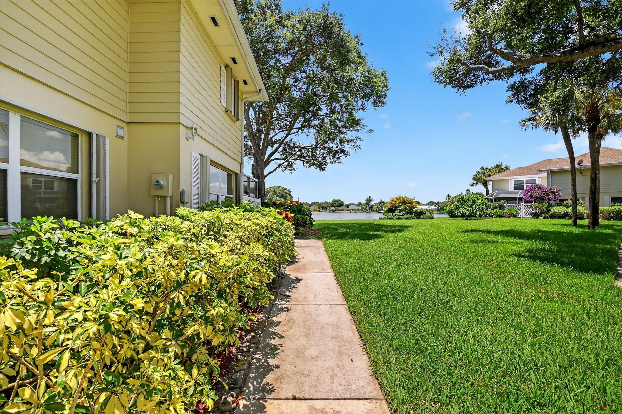 Renovated 2 bedroom 2.5 bathroom townhome with plenty of natural light and lakefront views. This home features laminate flooring throughout the living space. Spacious kitchen with granite countertops, stainless steel appliances and an additional pantry. The bedrooms upstairs feature ensuite bathrooms and have views of the lake. All lighting fixtures and fans have been upgraded. Plenty of storage with standing room above the second bathroom (pull down stairs). The large, screened in patio offers space for a grill, firepit and full size patio set. Enjoy the weather outside with beautiful views of the lake and sunset. Located in the desirable Wellesley community with 24 hour manned security, community pool and hot tub. Make your appointment to view your next home today!