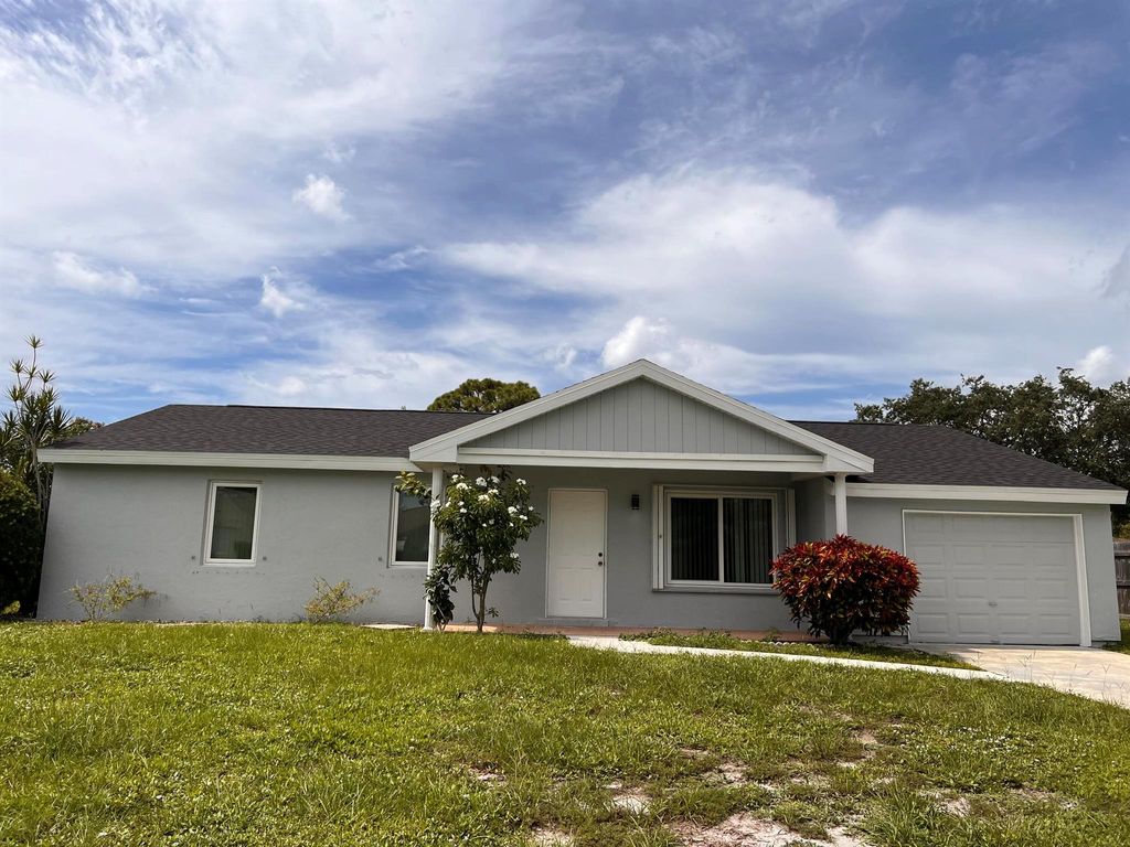 Photo of 1742 SE Burgundy Lane, Port Saint Lucie, FL 34952 (MLS # R11021845)