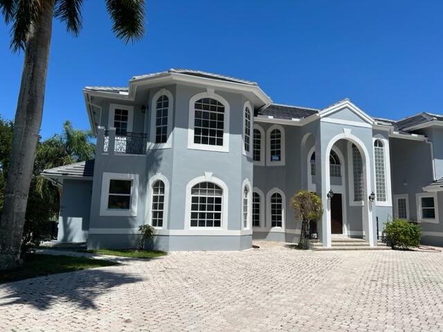 1 ACRE SPECTACULAR LAKE FRONT ESTATE HOME LOCATED ON A PRIVATE CUL-DE-SAC IN A MULTI-MILLION DOLLAR 24 HOUR MAN-GATED COMMUNITY. THIS TWO-STORY HOME HAS BEAN REDONE WITH NEW KICTHEN AND APPLIANCES NEW FLOORS THROUGH OUT, NEW BATHROOMS, NEW ROOF, FRESHLY PAINTED INSIDE & OUT, 6 OR 7 BEDROOMS & 5 AND HALF BATHROOMS. PLUS, AN OFFICE, DEN & EXERCISE ROOM. 50FT POOL 9 FT. DEEP ON ONE END, W JACUZZI AND LARGE PATIO OVERLOOKING PRIVATE LAKE AND TROPICAL LANDSCAPING. A RARE FIND! ALL IN BOCA RATON BEST SCHOOL DISTRICTS.