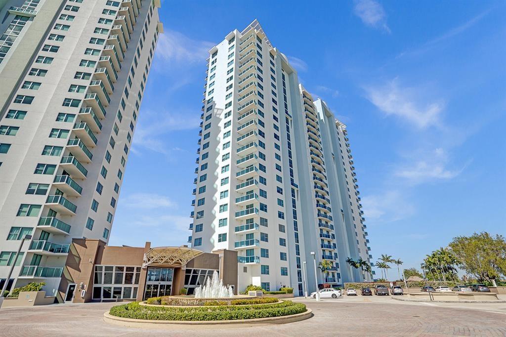 Watch the Sunset over the lake in this resort style unit located just across from the Sawgrass Mall and Staduim. Fine dining and shopping in walking distance. This 2 bedroom 2 bathroom unit has a washer and dryer. The building features a business center, gym, pool, conference room, sauna, sports lounge, social hall, tennis court and playground. Throughout the property there are lounge areas. Living in this building feels like a 5 star resort. The view from this unit overlook the lake and pool deck. Perfect location for corporate clients, or families. 24 hour security and lobby concierge. The ideal location for a vacation home. Garage space is located close to unit.
