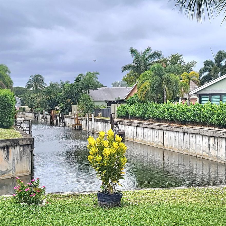 Updated 1st floor waterfront condo with parking directly in front, 1 year new completely renovated kitchen with custom counters and backsplash, white cabinetry with lighting, stainless steel appliances, views of canal, large closed in porch with serene canal views & fan, accordion shutters, ceramic tile floors, 5 yr new a/c & 3 year new tankless water heater, convenient and friendly gated active 55+ community with 2 clubhouses, swimming pools,  newly resurfaced tennis courts, bocci, updated fitness center with updated equipment, billiards, ping pong, sauna, library, shuffleboard, 6 new pickle ball courts, on site manager, lots of social activities and clubs, minutes from Beach and the hip Atlantic Avenue for entertainment, dining and more!  Prime Location. Ready for you to move right in!