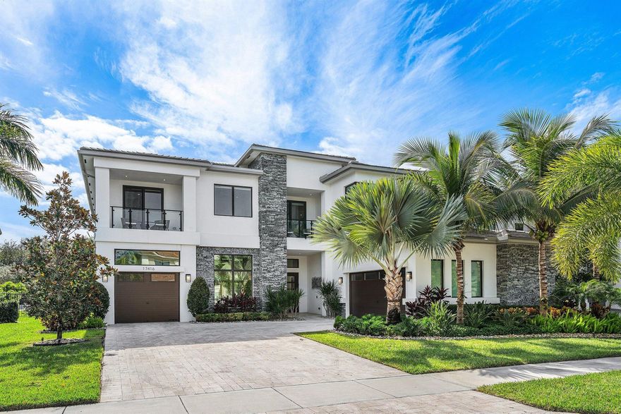 Welcome to a one of a kind, custom-built ''Contemporary Veneto Estate'' in the exclusive Boca Bridges community. Meticulously crafted for the most discerning homeowner, spanning approximately 6,000 SF, 17416 Ponte Chiasso Drive features 5 generously appointed bedrooms and 7 elegant bathrooms. The Primary Suite is conveniently located downstairs, along with one other downstairs ensuite guest room, a Sauna/Yoga Studio, designated office, beautifully designed Club Room (or private dining), a state-of-the-art home theater, your own work from home ''Starbucks'' lounge, and a meticulously curated outdoor retreat all tailored for both relaxation and entertaining! The interior embodies a sophisticated ''West Coast'' aesthetic, with large format 24x36 tiles and hardwood floors throughout.