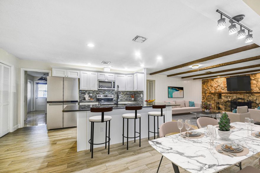 Spacious 3-Bedroom, 2-Bath Single-Family Home with Pool in the Heart of Coral Springs - No HOA!Welcome to this beautifully updated single-family home located in one of Coral Springs' most desirable and well-established neighborhoods. Offering comfort, space, and functionality, this 3-bedroom, 2-bathroom residence is perfect for families, entertainers, or investors alike.Step inside to an open and inviting floor plan featuring updated tile flooring throughout, creating a clean and modern flow from room to room. The  remodeled kitchen is equipped with large countertop, upgraded cabinetry, stainless steel appliances, and a spacious layout that opens seamlessly into the dining and family areas--ideal for both everyday living and hosting gatherings.