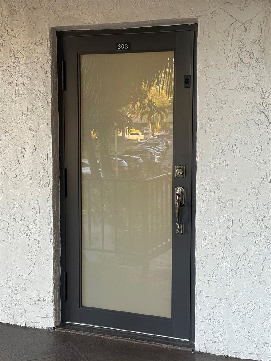 Beautifully renovated 1 bed 1 bath FULLY FURNISHED for rent in a one year lease. From the entrance you will see waterproof laminate flooring and in the kitchen and bathroom, there is tiling. there is new, built in microwave and stainless steel electric stove and stainless steel 3 door refrigerator.  Kitchen also has beautiful Corian counter top, backsplash and Shaker cabinets with stainless steel sink and built in pantry. Owner is leaving ALL furniture in unit and wall mounted TV in living area. Balcony has beautiful water view while you relax in the morning with a cup of tea with impact sliders overlooking the lake. Bedroom has water view as well. Unit is freshly painted with great exquisite accessories. Built in bathroom linen closet. Well maintained building. Laundry room on each floor.