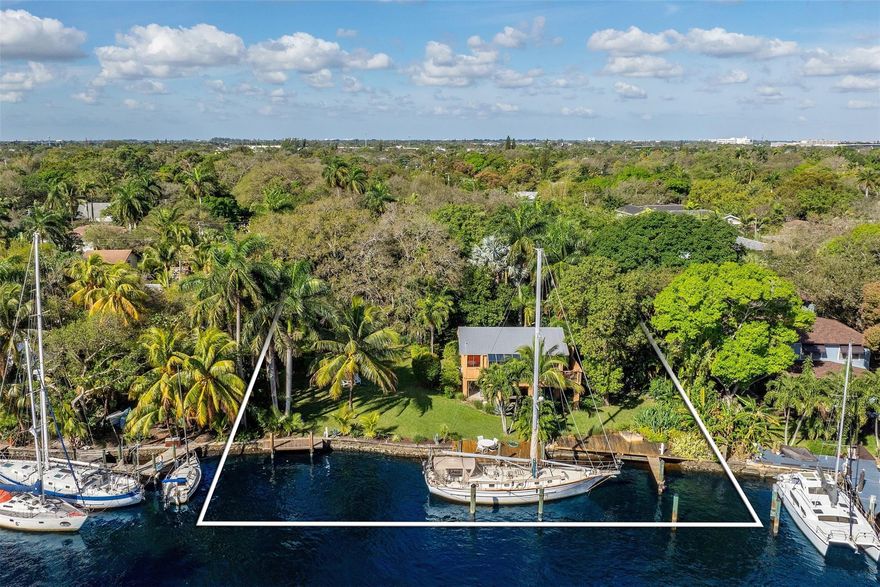 Rare to find hidden gem on South Fork of the New River consists of 3 separate build-able parcels totaling 3/4 acres with 135' of DIRECT DEEP RIVER WATERFRONTAGE. 3 folio numbers allow for 3 single family homes to be built. The over 200' wide River allows even Mega Yachts an easy turn around. Outstanding, peaceful old Florida Park like property will be the prime dockage for your deep draft Yacht. Enjoy incredible sunrises & full moon views of downtown and watch a never ending boat parade from your favorite spot on the property. A private well/sprinkler system assures irrigation all year round for all 3 properties. This tropical paradise offers plenty of space for entertainment, quiet time if you wish and is only minutes away from lively downtown Fort Lauderdale and International Airport.