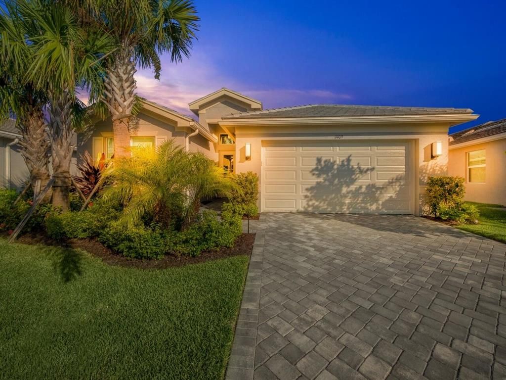 Photo of 11409 SW Half Moon Lake Lane, Port Saint Lucie, FL 34987 (MLS # R10746390)