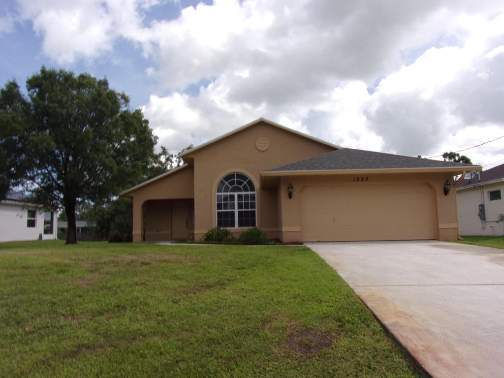 Photo of 1225 SW Milan Lane, Port Saint Lucie, FL 34953 (MLS # B26071414)