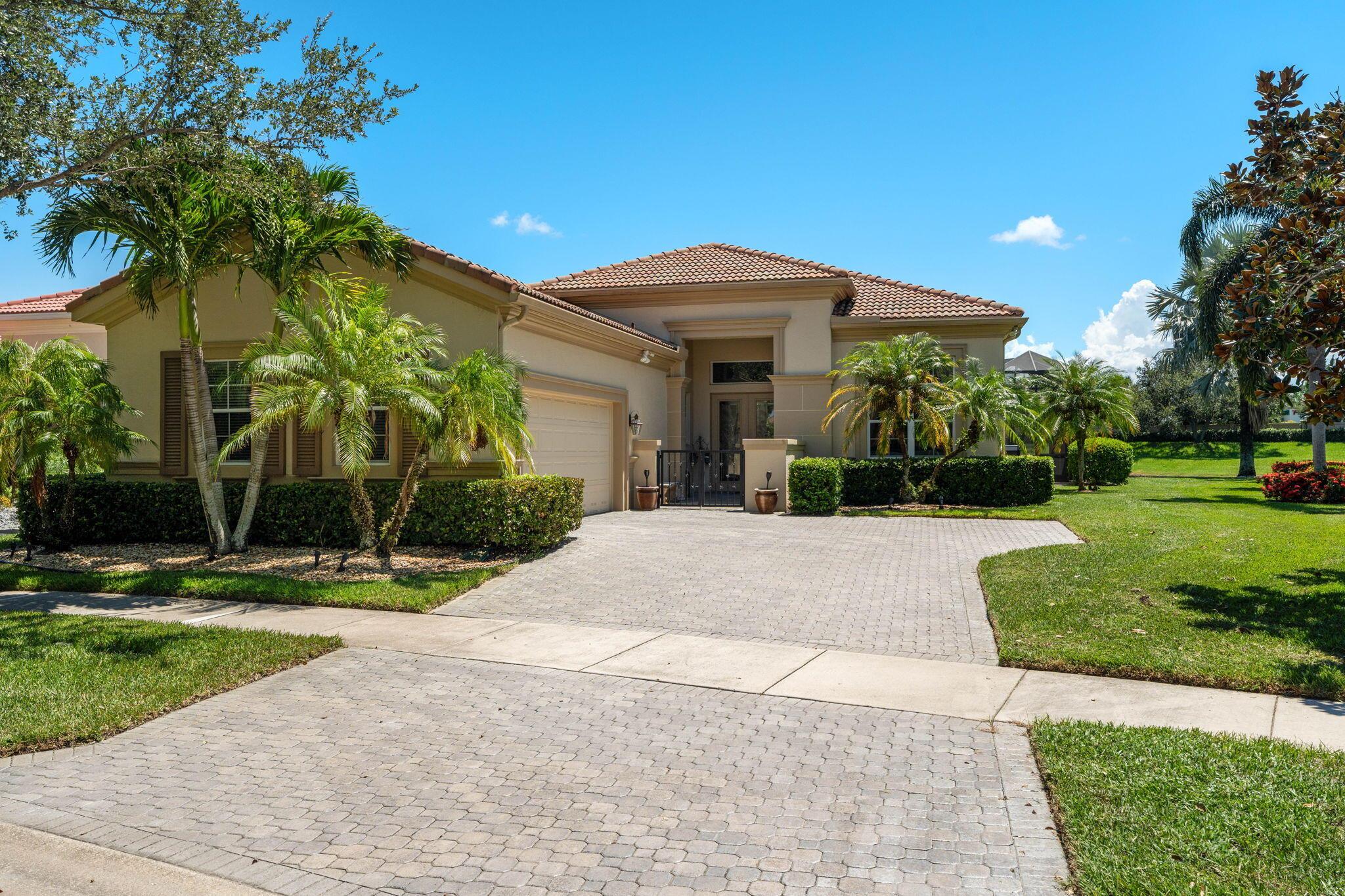Stunning home in VERANO with spectacular lake views and unique courtyard entrance! Fantastic curb appeal! The Dulce floor plan has formal living & dining room, 3 BR's, 3 Full Baths and half bath. 2.5 Car Garage. Family room with sliders to your private oasis pool with screen enclosed patio. Master suite w/ sitting rm, 2 walk-in closets, plus grand master bath with his/her accommodations. Guests will be comfortable in either of the ensuite bedrooms. Gourmet EAT IN kitchen is well appointed with Quartz counter tops, beautiful backsplash, Stainless steel appliances, pantry & double wall ovens. Numerous upgrades throughout the house include plantation shutters, crown molding, hurricane impact glass and more. All in the very desirable family friendly PGA Verano community built by Kolter.