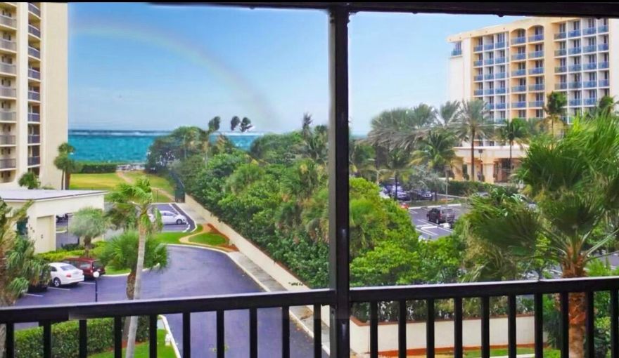 Stunning oceanfront 2BR/2BA condo with sweeping Atlantic views and direct private beach access in the gated Ocean Trail community. Beautifully renovated with an open floor plan, engineered vinyl wood-tile flooring, upgraded fixtures, custom finishes, smart-home AC, wine fridge, wet bar, and a stone accent wall with electric fireplace. Renovated kitchen and spa-inspired baths throughout.

The primary suite features custom barn doors, a clawfoot soaking tub, separate spa shower, double sinks, walk-in closet, and a luxurious retreat feel. The second bedroom and bath can be closed off with elegant barn doors, creating a private second primary suite. In-unit washer/dryer and a spacious screened balcony overlooking the ocean and Jupiter Beach Resort & Spa. 4 star Jupiter Beach Resort & Spa /restaurant FOB access included.
Resort-style amenities include 22 gated oceanfront acres with 24-hour manned security, covered parking, storage, tennis, pickleball, bocce, heated pools, hot tubs, sauna, fitness center, grills, walking paths, lap pools, and private beach access. Walk to par 3 golf, dining, shopping, parks, Riverwalk, Cinepolis, Fresh Market, upcoming Whole Foods, and Maltz Theatre. Complimentary golf cart shuttle available.