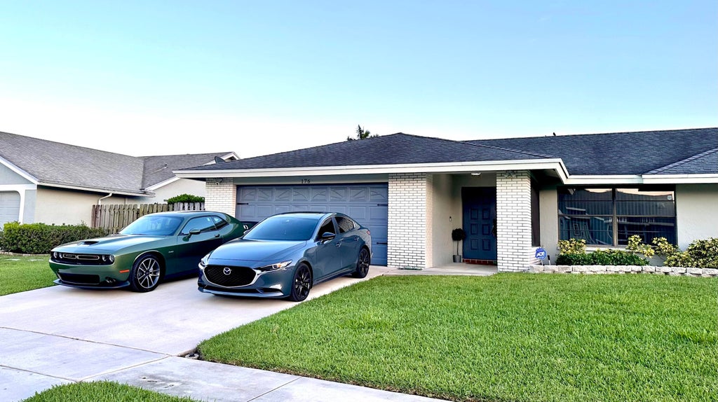 Photo of 176 Roycourt Circle, Royal Palm Beach, FL 33411 (MLS # R10946982)