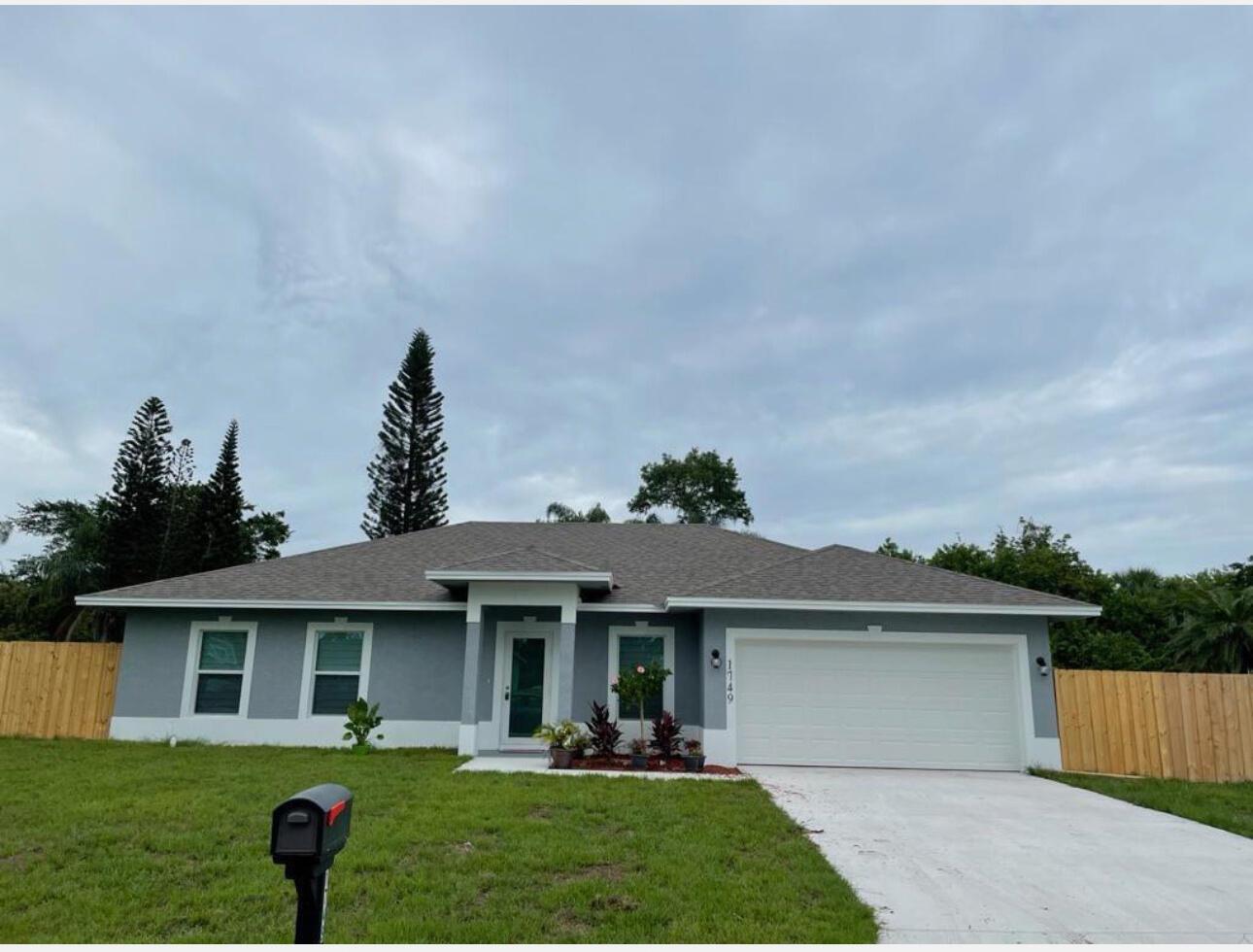 Beautiful 4 bedroom, 2 bathroom, split floor-plan home. White cabinets, granite counter tops and high ceilings, spacious fenced in yard to entertain. Close to US Hwy1, major shopping, park, and Port St Lucie hospital.