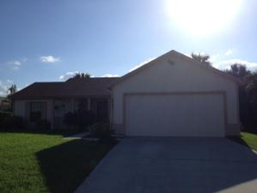 CANAL FRONT 3-2-2 WITH FULLY FENCED YARD AND HUGE SCREENED PATIO, PET FRIENDLY.. Has tile throughout the living and dining room, carpet in bedrooms.. In quiet peaceful neighborhood, has great views of the canal and plenty of fenced yard area for the family to play in. Up against vacant lot for added privacy. A must see!