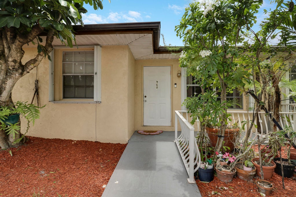 Photo of 968 Sumter Road W, West Palm Beach, FL 33415 (MLS # R11102469)